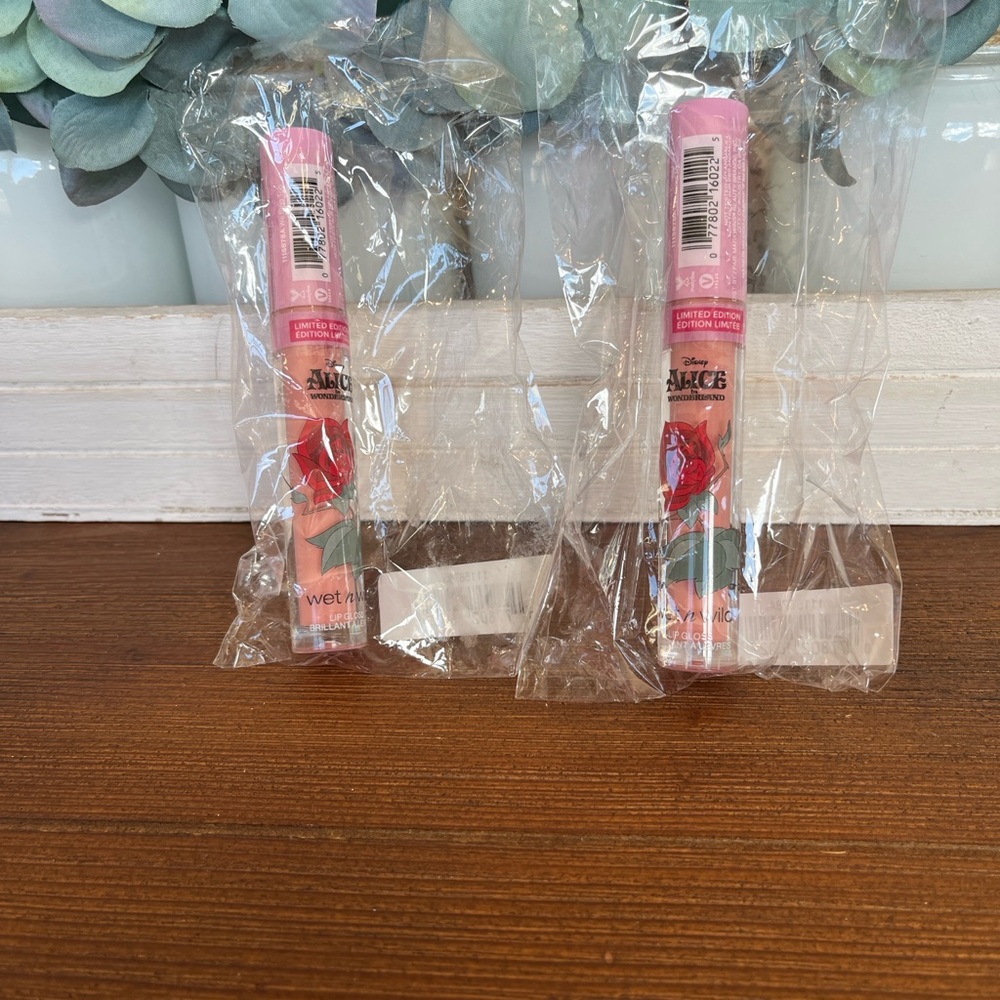 NWT Set of two Disney Wet n Wild Alice in Wonderland Pink Lip Gloss